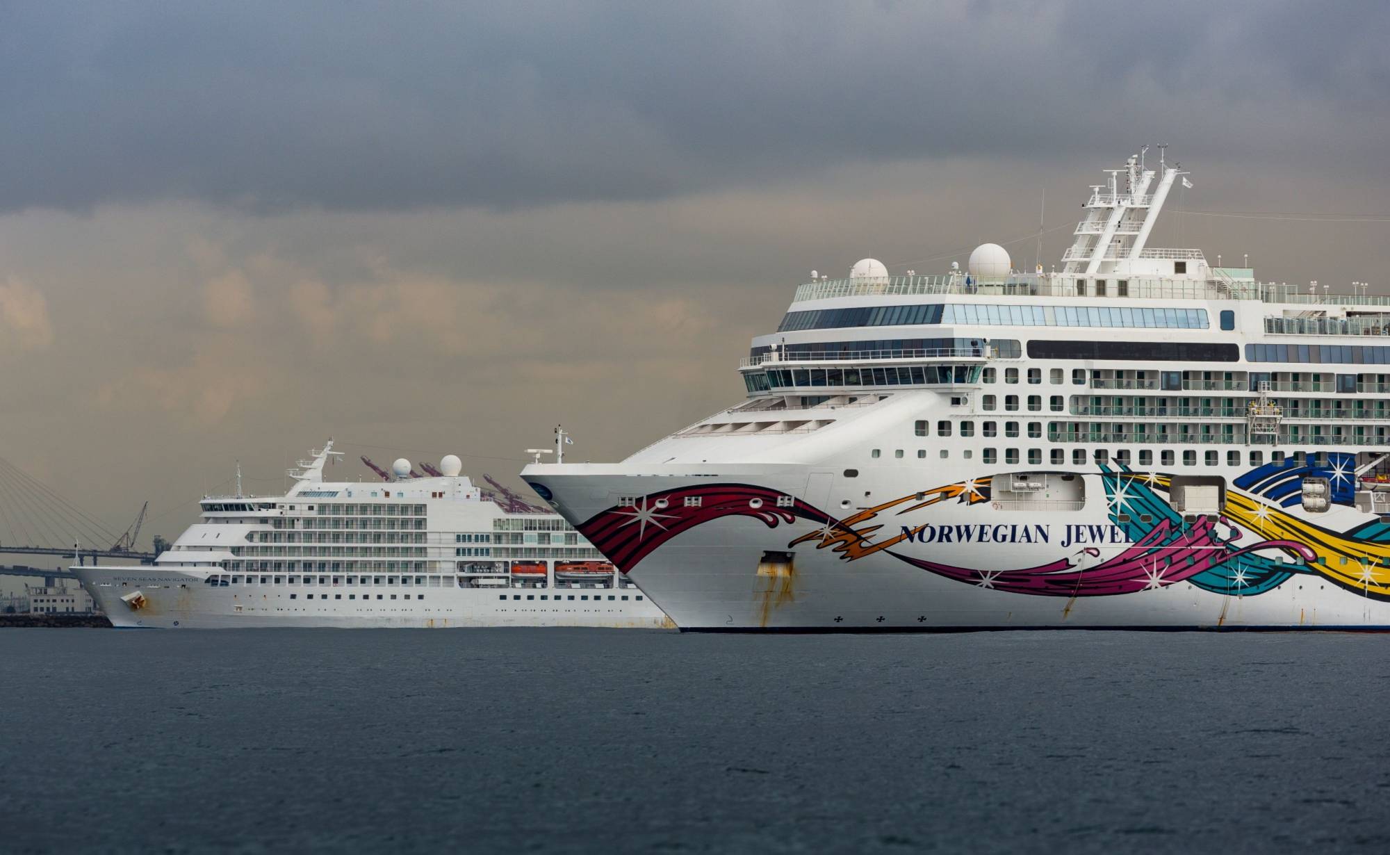 Two cruise ships sit idle near the Port of Los Angeles and Port of Long Beach in Long Beach, California, in April. | BLOOMBERG
