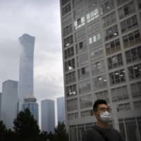 The central business district in Beijing. According to an estimate, Shanghai saw 27,000 deaths from Jan. 1 due to smog, more than the 22,000 in Beijing. | AP