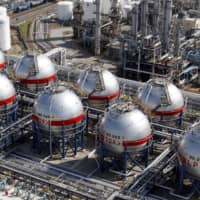 LPG tanks stand at an energy plant in Ichihara, Chiba Prefecture. Wholesale prices in Japan fell 1.6 percent in June due to weak demand for a variety of products amid the coronavirus pandemic. | KYODO