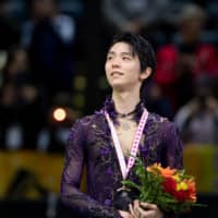Yuzuru Hanyu stands on the podium after winning the men\'s competition at Skate Canada on Oct. 26 in Kelowna, British Colombia. Hanyu was named Most Valuable Skater for the 2019-20 season in the inaugural ISU Skating Awards on Saturday. | USA TODAY / VIA REUTERS