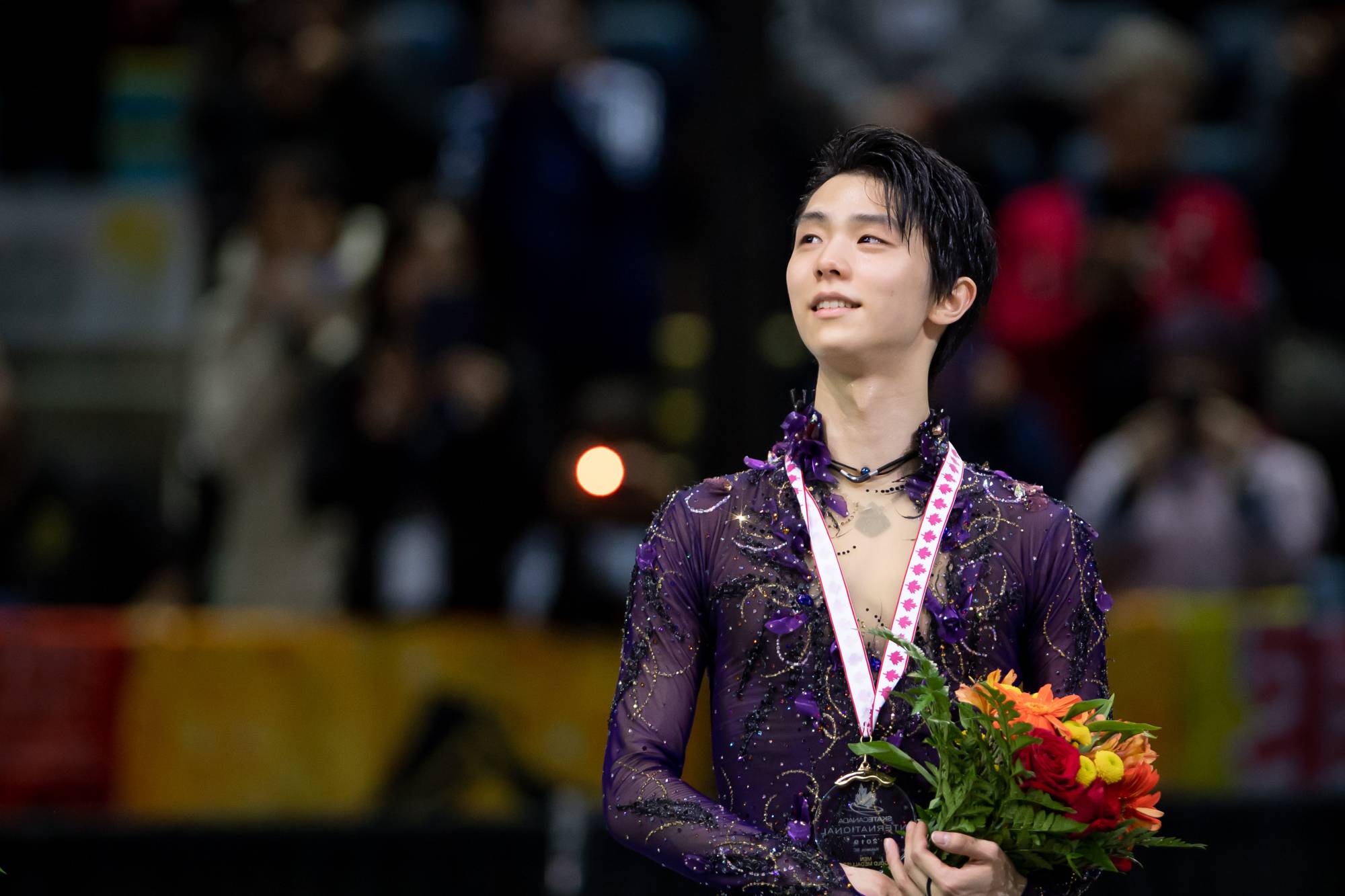 Yuzuru Hanyu stands on the podium after winning the men's competition at Skate Canada on Oct. 26 in Kelowna, British Colombia. Hanyu was named Most Valuable Skater for the 2019-20 season in the inaugural ISU Skating Awards on Saturday. | USA TODAY / VIA REUTERS