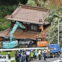 A mudslide-damaged house in Higashihiroshima, Hiroshima Prefecture, on Tuesday | KYODO