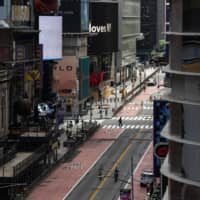 A nearly empty street is seen in Times Square on June 11, days after New York City\'s lockdown eased. New research shows that economic losses have come mainly from fear, not government mandates.  | BLOOMBERG