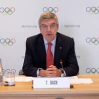 IOC President Thomas Bach speaks during a news conference in Geneva on Wednesday. | IOC / GREG MARTIN / HANDOUT VIA REUTERS
