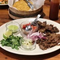 Full plate: A platter of cumin lamb and suadero (brisket) tacos at Kitade Shokudo. | ROBBIE SWINNERTON

