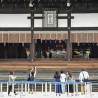 The canopied Takamikura imperial throne in which the emperor proclaimed his enthronement last October is seen on public display at Kyoto Imperial Palace on Saturday. | KYODO