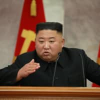 North Korean leader Kim Jong Un guides a Central Military Commission meeting in this photo released Sunday. The commission, which is responsible for the development and implementation of the ruling party’s military and defense policies, discussed bolstering the country’s “war deterrent,” an implicit reference to its nuclear weapons. | KCNA / VIA REUTERS