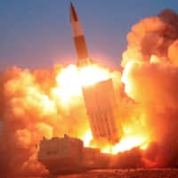 An apparent North Korean ballistic missile is fired in this image released on March 22. | KCNA / VIA REUTERS