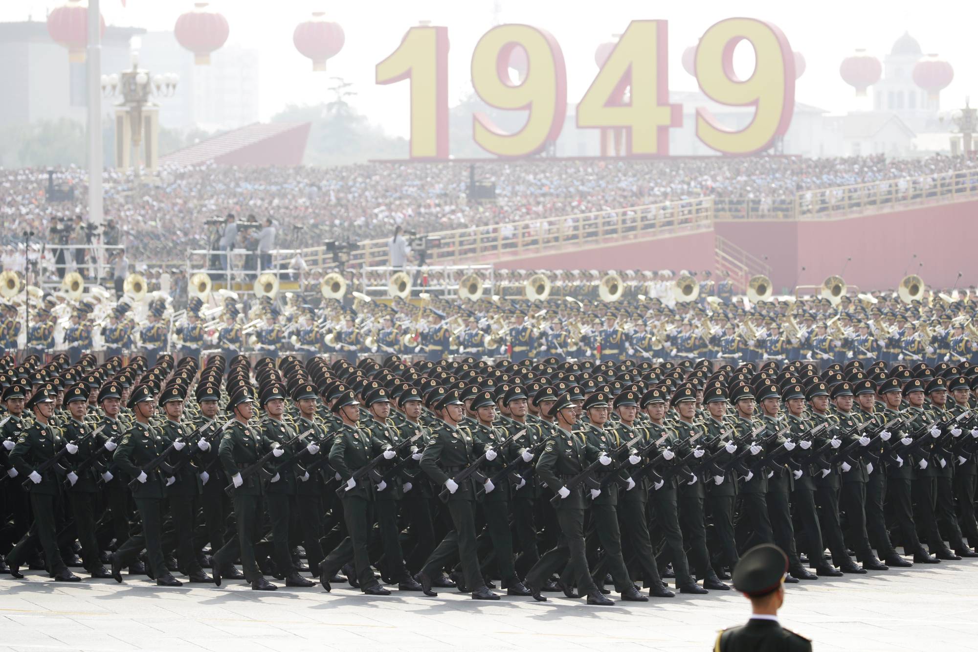 People's Liberation Army soldiers march in formation during a military parade in Beijing marking the 70th founding anniversary of People's Republic of China on Oct. 1. Nationalism has played a key role in bolstering the Chinese Communist Party's legitimacy. | REUTERS