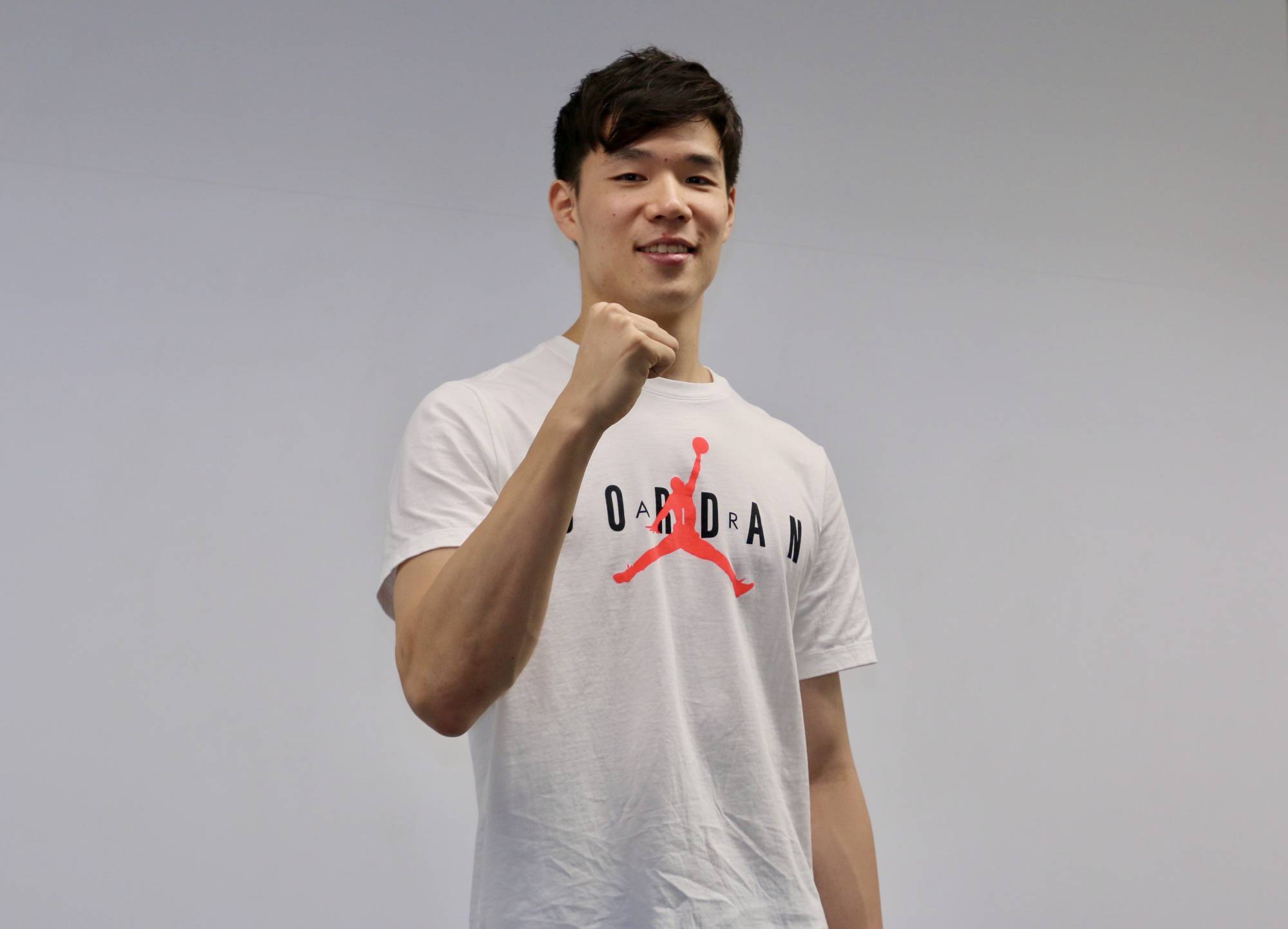 Yudai Baba poses for photos during a news conference Monday at the Japan Basketball Association office. | KAZ NAGATSUKA
