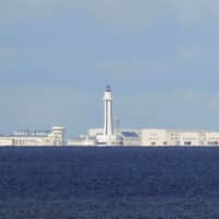 Chinese structures are pictured at the disputed Spratly Islands in the South China Sea in April 2017. After Washington last week hardened its position by explicitly rejecting Chinese maritime claims in the South China Sea, U.S. embassies in the region produced an unprecedented flurry of op-eds and statements criticizing Beijing\'s actions, including through social media outlets. | REUTERS