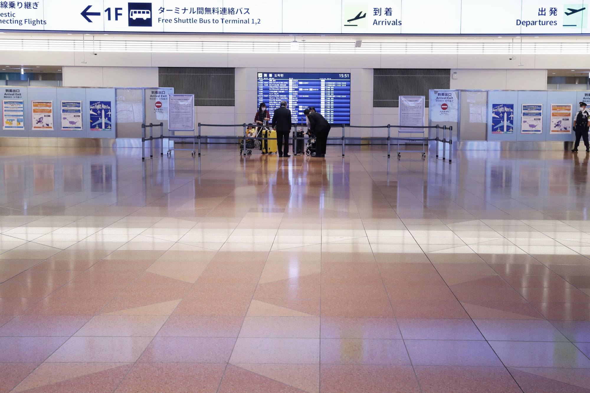 The international arrival lobby at Haneda Airport in Tokyo is almost empty on April 15 amid the novel coronavirus pandemic. | KYODO