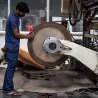 As India\'s coronavirus cases exceeded one million last week, unions say similar spikes in infections in reopened factories are putting workers at risk — accusing companies of skimping on health and safety as they rush to get business back on track. | AFP-JIJI