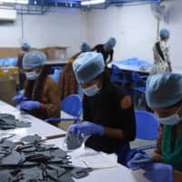 Labor advocates in India say the measures in place at factories do not go far enough, calling for more routine inspections, guaranteed living wages, as well as housing and transportation for workers during the pandemic. | AFP-JIJI