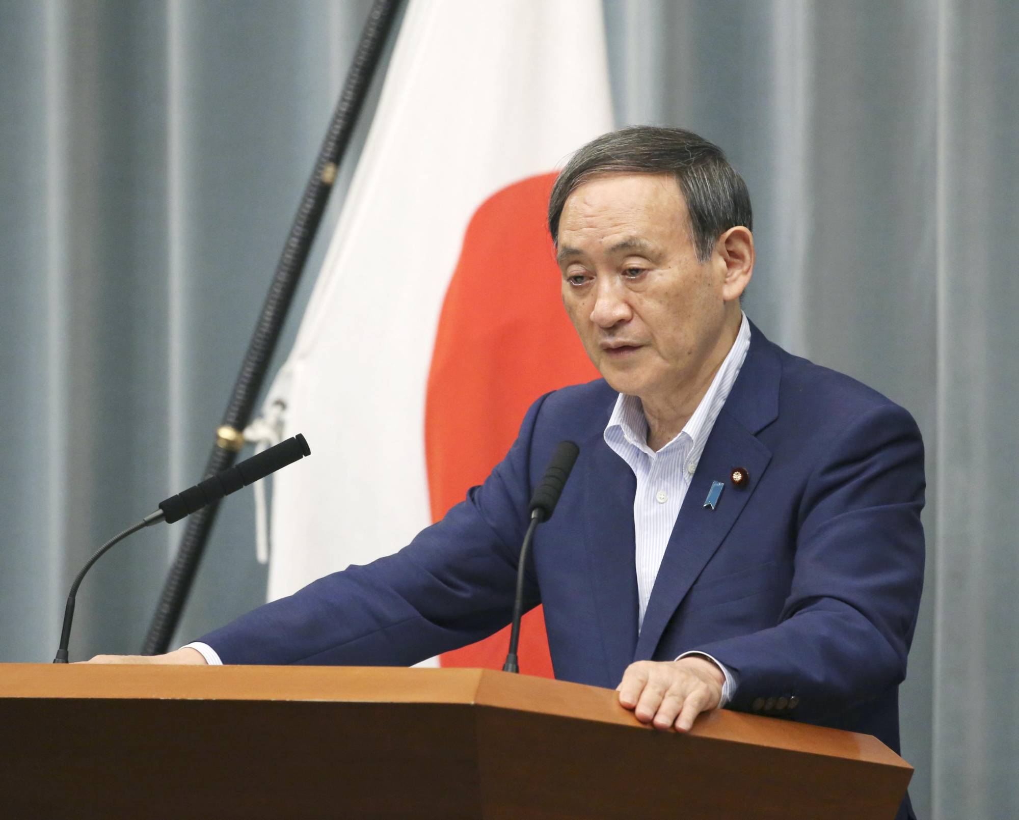 Chief Cabinet Secretary Yoshihide Suga speaks at a news conference at the Prime Minister's Office Wednesday. | KYODO