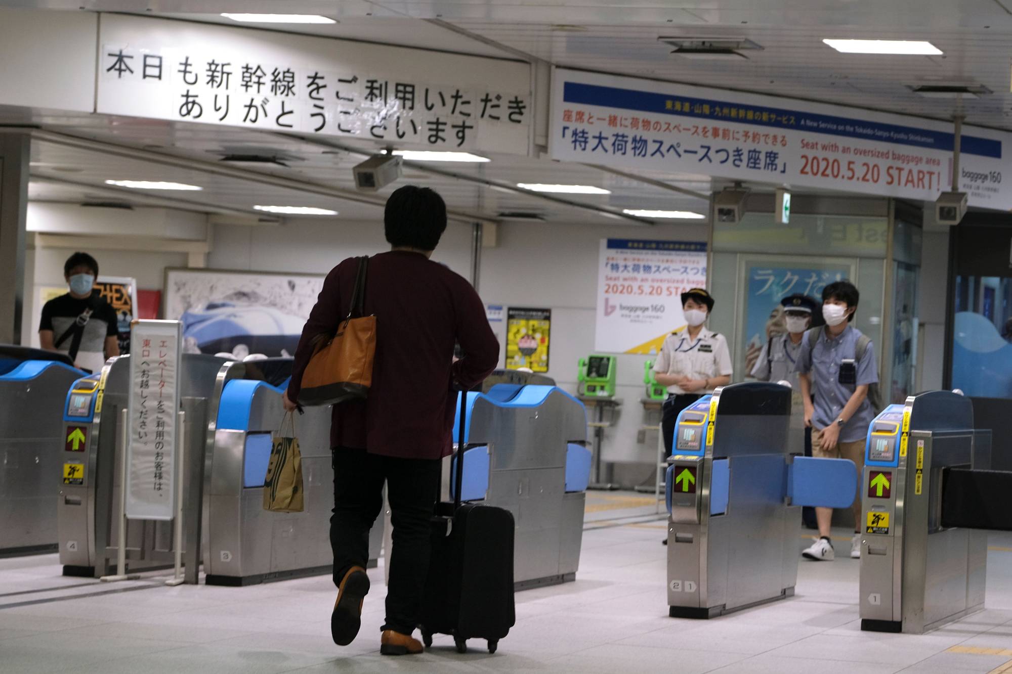 A traveler walks toward a ticket gate for bullet trains at Shin-Yokohama Station in Yokohama on Wednesday. | AFP-JIJI