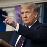 U.S. President Donald Trump speaks during a news conference at the White House on Tuesday. Trump expressed a willingness to work with China or other countries to bring a successful coronavirus vaccine to the United States, despite rising tensions between Beijing and Washington. | AP