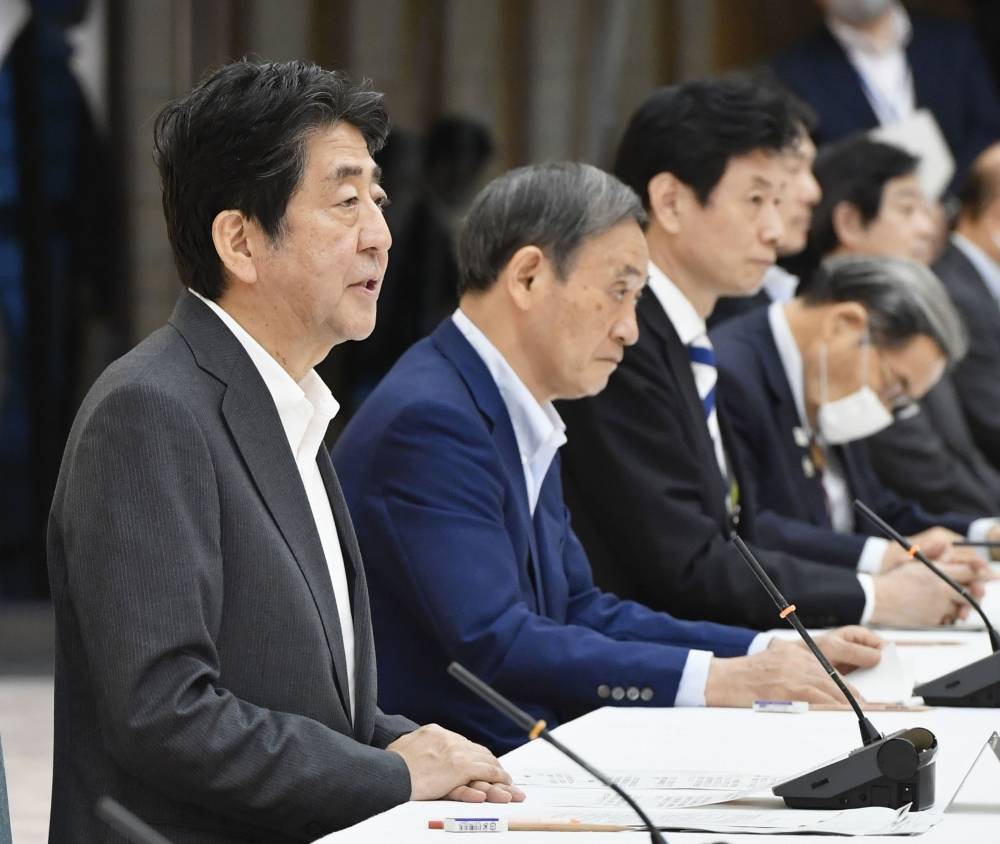 Prime Minister Shinzo Abe attends a meeting of the government's coronavirus task force on Wednesday. | KYODO