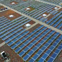 Solar panels sit on top of a warehouse near the hydrogen electrolysis plant at Energiepark Mainz, operated by Linde AG, in Mainz, Germany. About 40 percent of the electricity in the first half in the 27 EU countries came from renewable sources, compared with 34 percent from plants burning fossil fuels. | BLOOMBERG