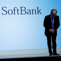 SoftBank Group Corp. Chief Executive Masayoshi Son bows after his presentation at a news conference in Tokyo in November 2018. | REUTERS