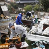 Residents of the village of Kuma, Kumamoto Prefecture, brace for another round of torrential rain expected this weekend. They are still reeling from the previous damage caused by heavy rain earlier this month. | KYODO