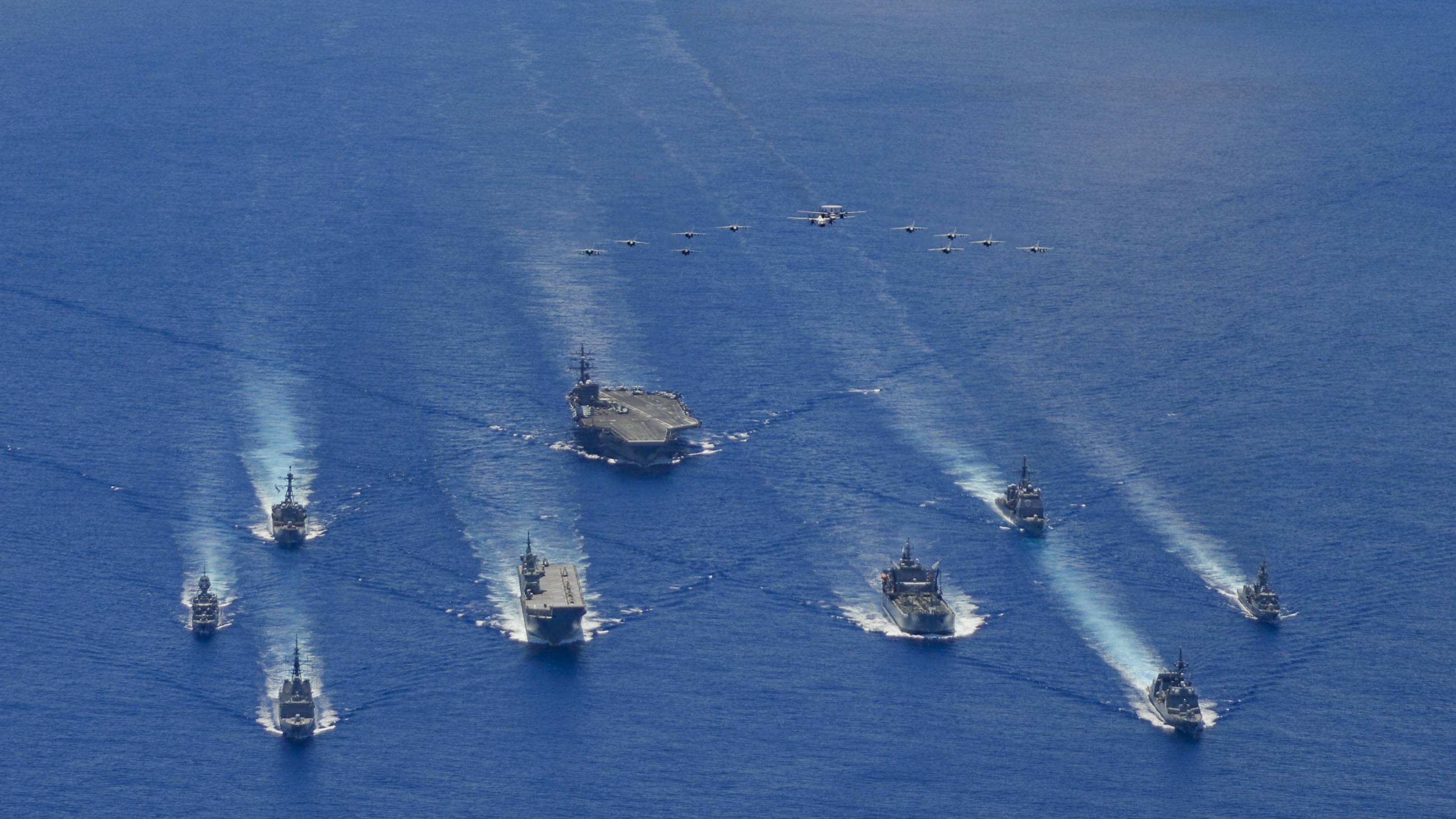 The USS Ronald Reagan Carrier Strike Group and units from the Maritime Self-Defense Force and Australian Defense Force participate in trilateral exercises in the Philippine Sea, on the doorstep of the disputed South China Sea, earlier this week. | U.S. NAVY