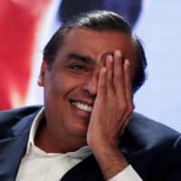 Mukesh Ambani, chairman and managing director of Reliance Industries, answers a question during a media event in New Delhi in June 2017.  | REUTERS
