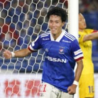 Marinos midfielder Keita Endo celebrates after scoring against Yokohama FC on Wednesday in Yokohama. | KYODO