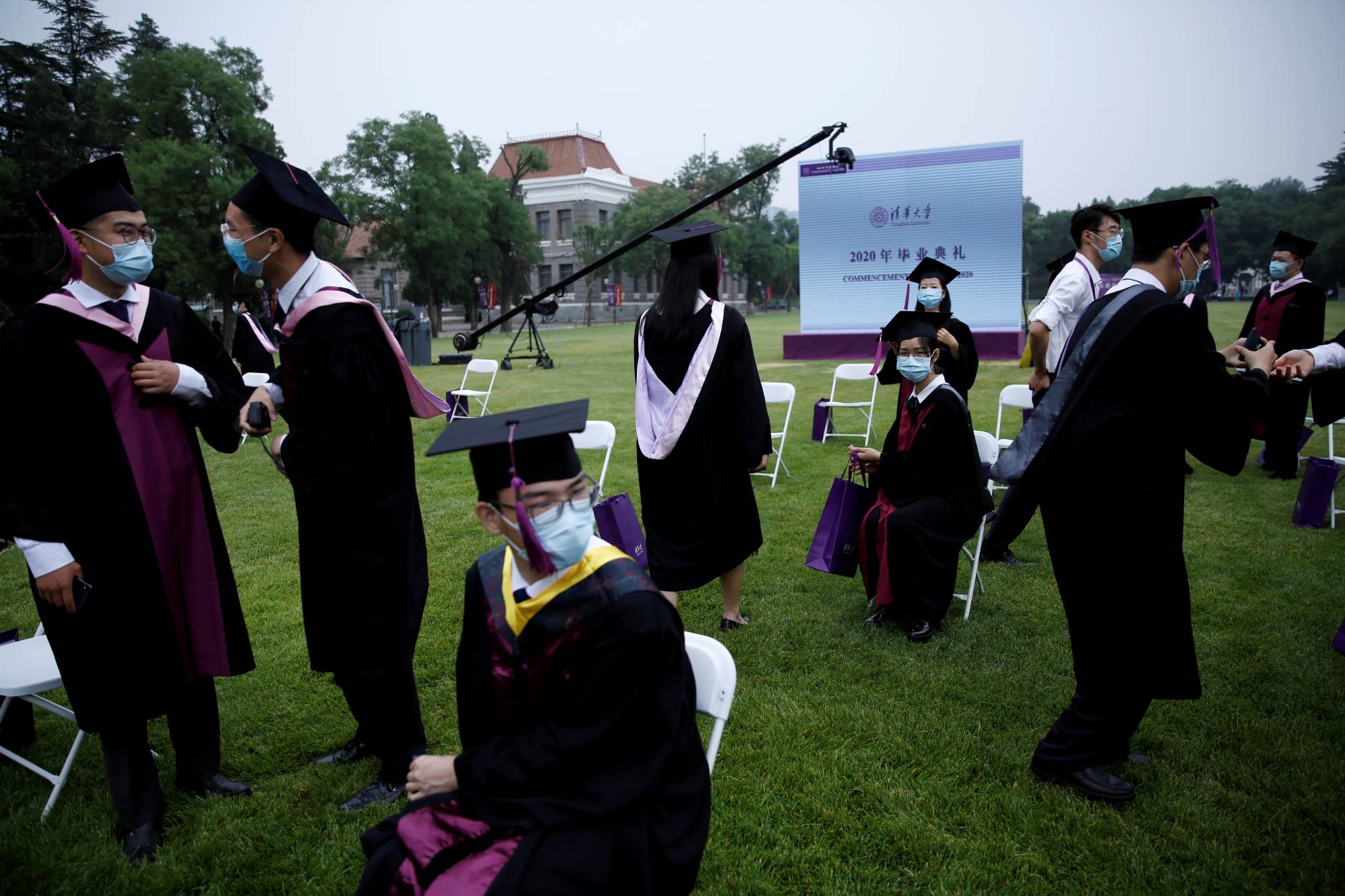 Undergraduate students attend a graduation ceremony at Tsinghua University in Beijing on June 23. | REUTERS