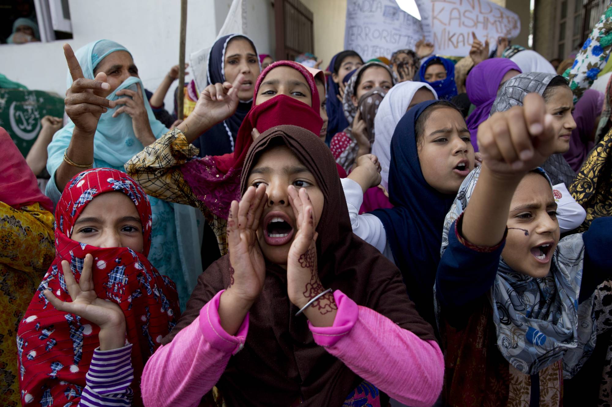 Kashmiri girls shout freedom slogans during a protest after Indian government scrapped the region's semi-autonomy and imposed an unprecedented security clampdown in Srinagar. | AP