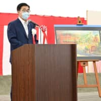 Aichi Gov. Hideaki Omura speaks at a ceremony to mark the start of construction of the Ghibli Park in Nagakute, Aichi Prefecture, on Tuesday. | KYODO