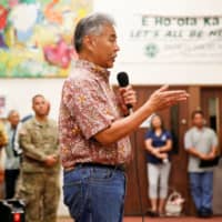 Hawaii Gov. David Ige speaks at a community meeting about the then-eruptions of Kilauea Volcano, in Pahoa, Hawaii, in May 2018. | REUTERS