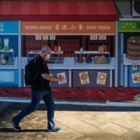 New infections in Hong Kong have broken records on nine of the last 20 days. But unlike other global cities, Hong Kong has been reluctant to impose stay-at-home restrictions or close nonessential businesses. | AFP-JIJI