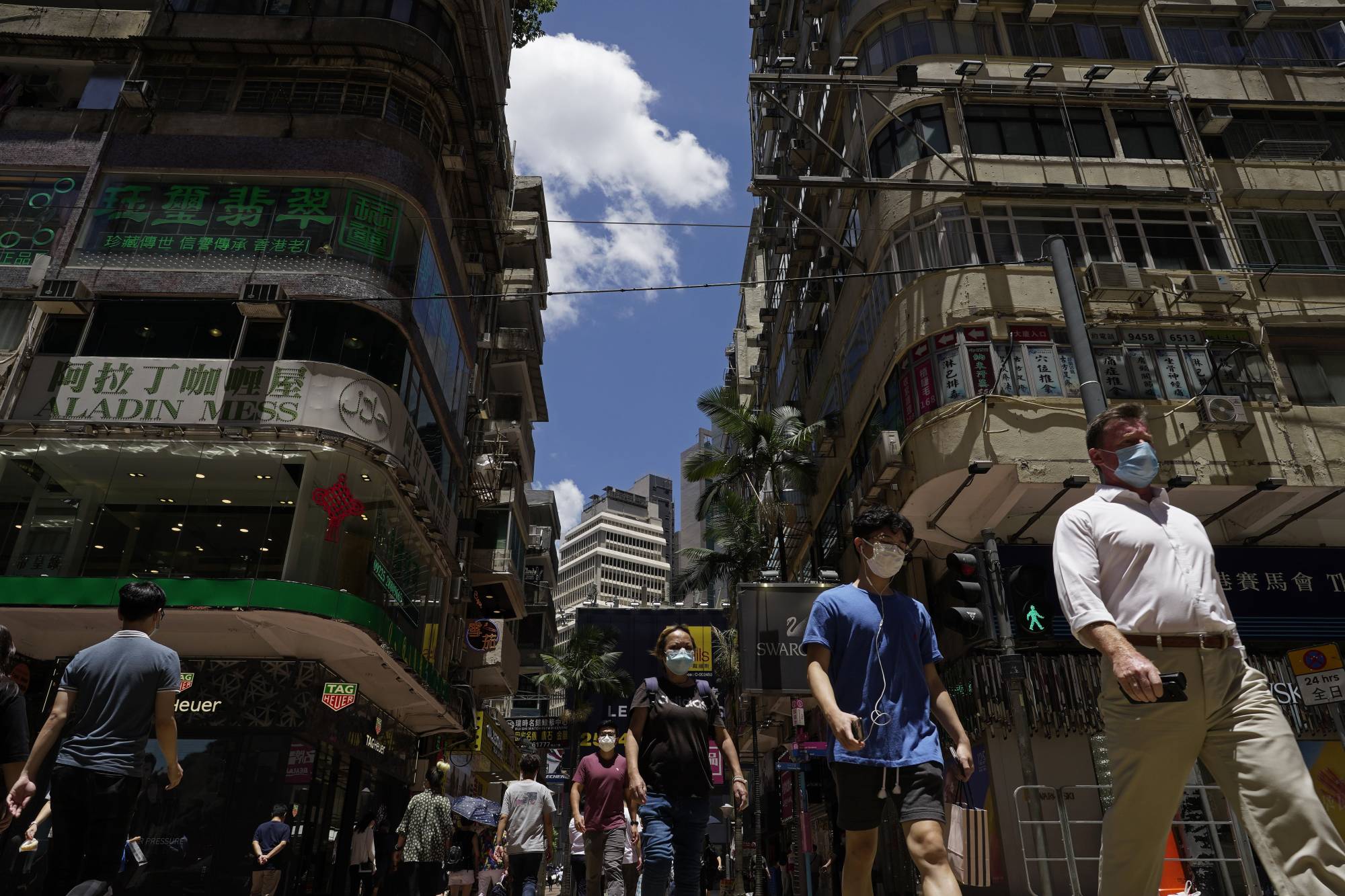 While still modest compared with outbreaks in many global cities, the uptick in Hong Kong is particularly troubling, arriving after months with near-zero community transmission and from as yet untraceable origins. | AP