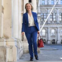 When trade talks between Britain and Japan started in June, U.K. International Trade Secretary Liz Truss said she wanted to go beyond the EU’s existing deal and bolster trade in digital services and data. | AFP-JIJI
