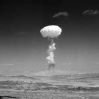 A gigantic pillar of smoke with the familiar mushroom top climbs above Yucca Flat, Nevada, during nuclear test detonation in April 1952. Nuclear analysts from the U.S. and Russia settled on a new method to account for atomic weapons that may shrink estimates on the size of North Korea’s arsenal and could be used to aid future disarmament. | AP