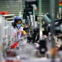 Data from China showed the country\'s manufacturing outlook improved for a second month in July. | AFP-JIJI
