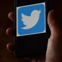 In a recent Twitter hack, fraudulent tweets soliciting investments in the digital currency bitcoin were posted in mid-July by 45 verified Twitter accounts. | AFP-JIJI