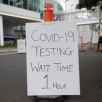 A drive-thru COVID-19 testing site at the Melbourne Sports and Aquatic Centre  | BLOOMBERG 