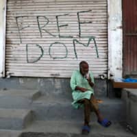 A Kashmiri man drinks tea in the Anchar neighborhood of Srinagar, India, on Tuesday. | REUTERS
