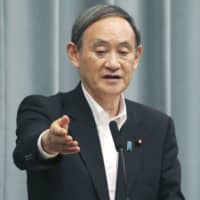 Chief Cabinet Secretary Yoshihide Suga speaks at a news conference at the Prime Minister\'s Office on Monday. | KYODO