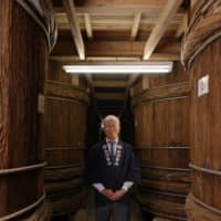 Carrying on a legacy: Kazuhiro Shibanuma is the 17th-generation head of Shibanuma Soy Sauce. “When I was a boy, there were still artisans making these vats, but they are all gone,” he laments. | SHOGO OIZUMI
