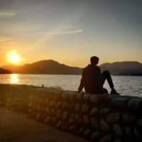 Happier times: Kaushik Kumar enjoys a sunset in a picture from when he was still in Japan.  | COURTESY OF KAUSHIK KUMAR
