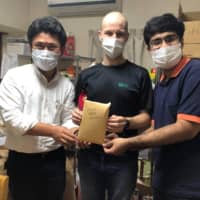 Helping hands: Wataru Ogura, Justin Velgus and Trishit Banerjee raised money for those affected by the pandemic in Sendai. | COURTESY OF TRISHIT BANERJEE
