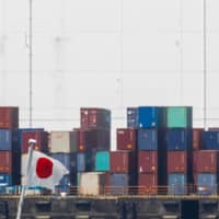 A wall of money printed by the central bank has kept a lid on bankruptcies and job losses, even as Japan\'s recession deepens. | AFP-JIJI