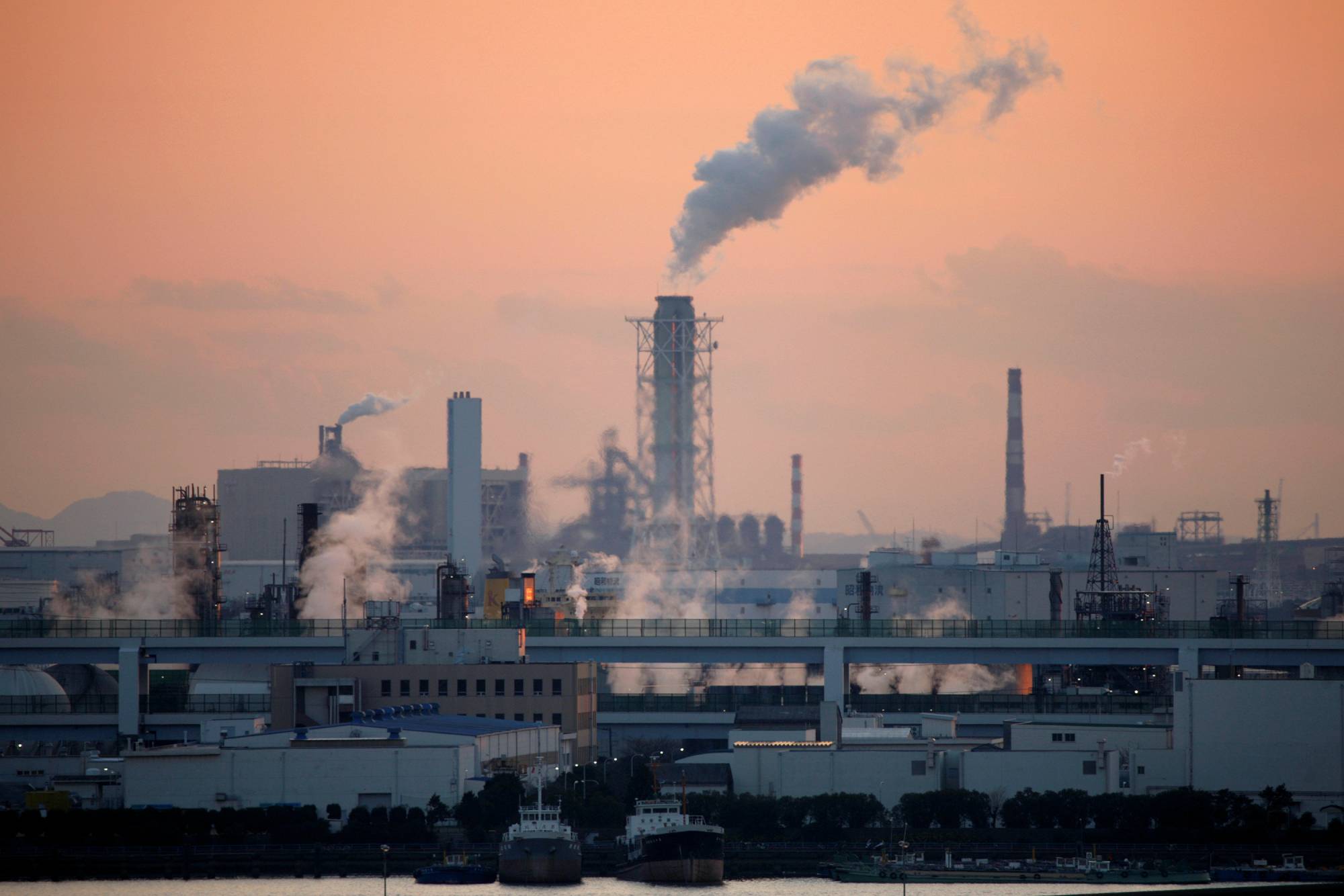 Factories are seen near Tokyo. The coronavirus pandemic may have caused structural changes in Japan's economy, requiring the Bank of Japan to tap more deeply into big data in making policy decisions. | REUTERS 
