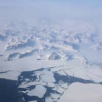 Broken up sea ice is seen from the window of a NASA Gulfstream III flight as part of a research mission above the east coast of Greenland March 2018. | REUTERS