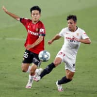 Mallorca\'s Takefusa Kubo (left), seen during a match against Sevilla in July, is moving to Villareal on a one-year loan from Real Madrid. | GETTY IMAGES / VIA KYODO