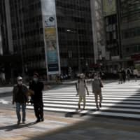 Although it’s partly due to increased testing, Tokyo continues to see daily infections in the triple digits, with numbers going over 200 for 12 consecutive days. | BLOOMBERG