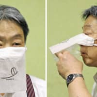 Japanese restaurant chain operator Saizeriya Co. has \"developed\" a face mask for use when eating and drinking, possibly a boon to eateries around the world hit hard by social distancing necessitated by the coronavirus. | KYODO